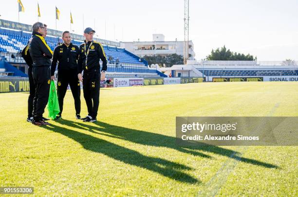 Peter Stoeger, head coach of Borussia Dortmund, together with his assistant coaches Joerg Heinrich and Manfred Schmid during a training session as...