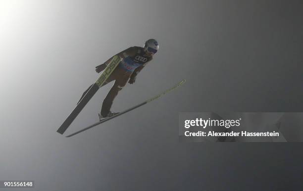 Kamil Stoch of Poland soars through the air during his qualification jump of the FIS Nordic World Cup Four Hills Tournament on January 5, 2018 in...