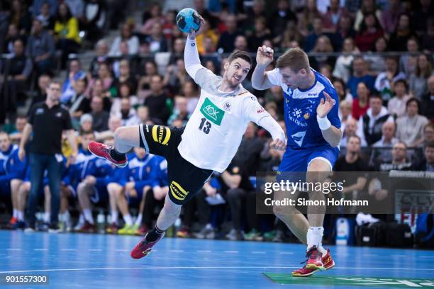 Hendrik Pekeler of Germany tries to score against Olafur Gudmundsson of Iceland during the International Handball Friendly match between Germany and...