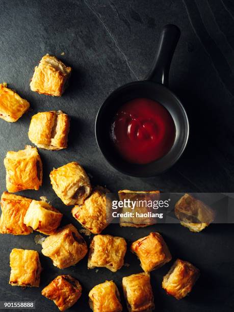 mini sausage rolls - sausage roll stock pictures, royalty-free photos & images