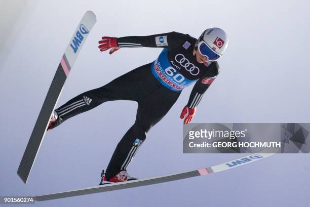 Johann Andre Forfang of Norway soars through the air during the training for the fourth and final stage of the Four-Hills Ski Jumping tournament in...