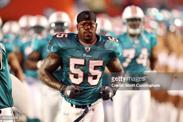 Joey Porter of the Miami Dolphins heads to the field to play against the Carolina Panthers during a preseason game at Land Shark Stadium on August...