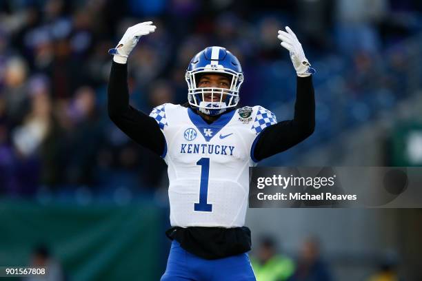 Lynn Bowden Jr. #1 of the Kentucky Wildcats celebrates against the Northwestern Wildcats during the Music City Bowl at Nissan Stadium on December 29,...