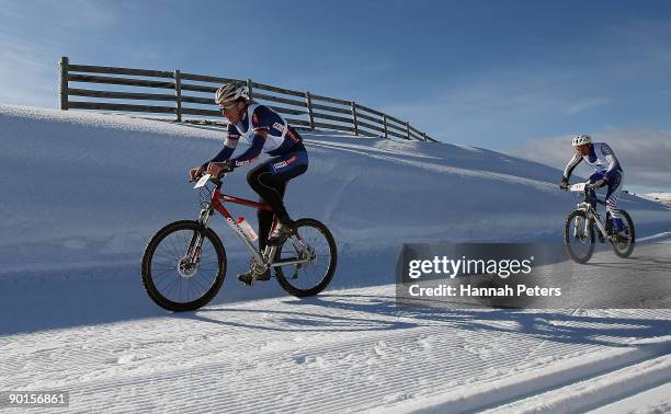 Gavin Mason of New Zealand and Ben Koons of New Zealand compete in the Winter triathlon during day eight of the Winter Games NZ at the Snow Farm on...