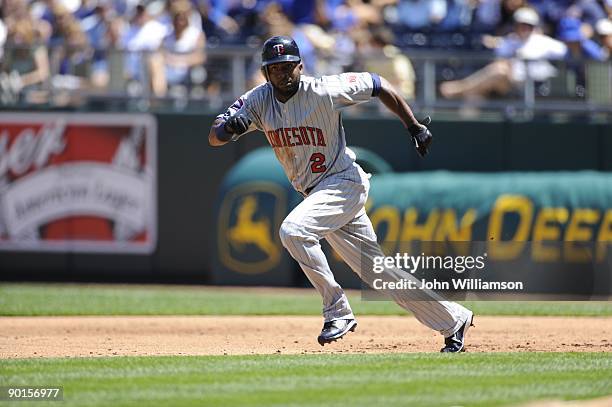 Denard Span of the Minnesota Twins runs on the pitch from first base during the game against the Kansas City Royals at Kauffman Stadium in Kansas...