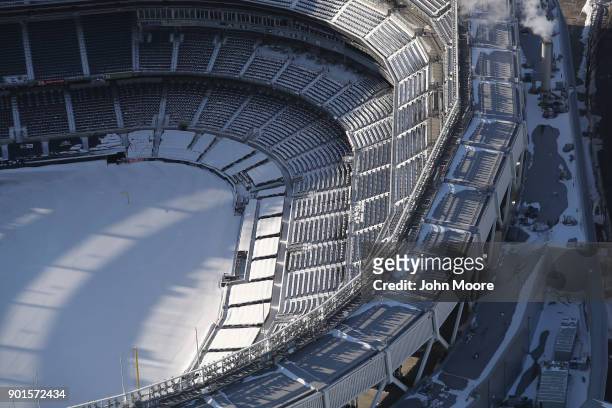 Yankee Stadium stands under a blanket of snow on January 5, 2018 in the Bronx Borough of New York City. Under frigid temperatures, New York City dug...
