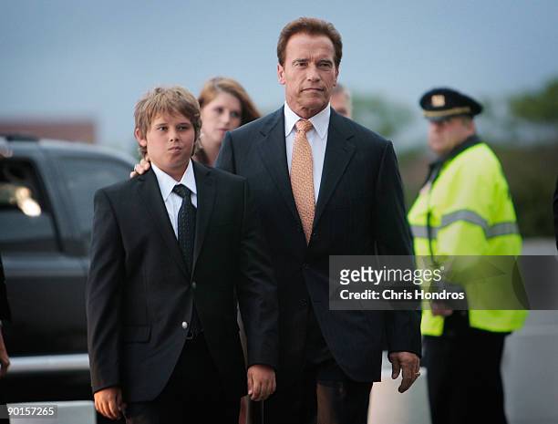 California Gov. Arnold Schwarzenegger arrives with members of his family at a memorial for U.S. Sen. Edward Kennedy at the John F. Kennedy...