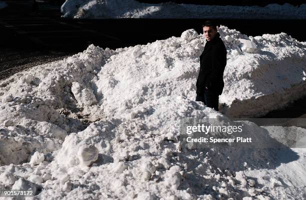 Man walks through the snow the morning after a massive winter storm on January 5, 2018 in Boston, United States. Schools and businesses throughout...