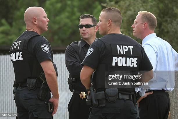 Pittsburg, California police officers stand in front of the home of alleged kidnapper Phillip Garrido as they search the property August 28, 2009 in...