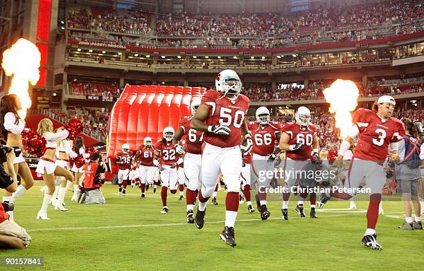 Melvin Fowler of the Arizona Cardinals runs onto the field alongside his teammates prior to the game against the Green Bay Packers at the University...