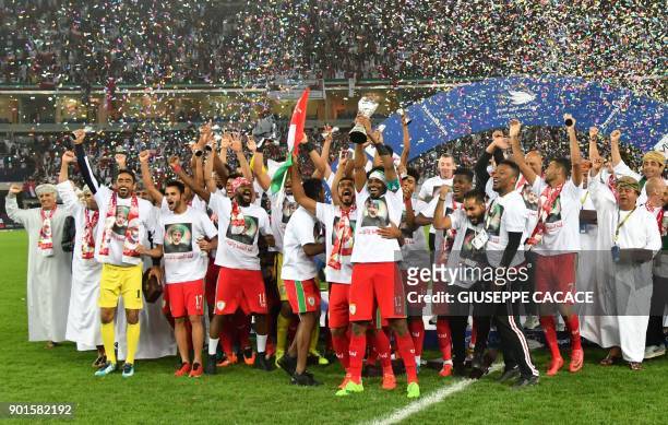 Oman's players celebrate after winning the Gulf Cup of Nations 2017 final football match between Oman and the UAE at the Sheikh Jaber al-Ahmad...