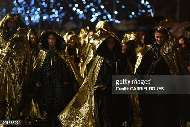 Entertainers take part in the traditional Three Kings parade marking Epiphany in Madrid on January 5, 2018.
