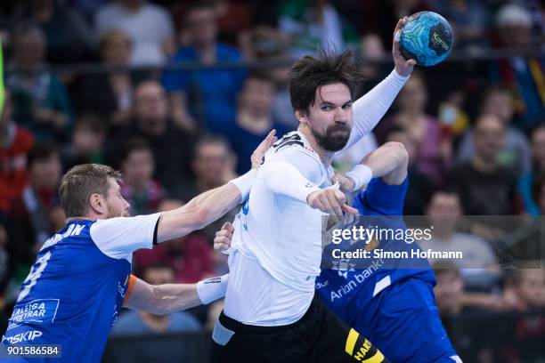 Fabian Wiede of Germany is challenged Janus Smarson and Gudjon Sigurdsson of Iceland during the International Handball Friendly match between Germany...