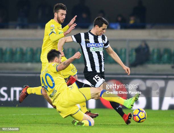 Nenad Tomovic of Chievo Verona competes with Kevin Lasagna of Udinese Calcio during the serie A match between AC Chievo Verona and Udinese Calcio at...