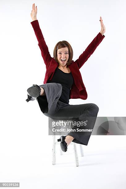 happy girl - woman excited sitting chair stock pictures, royalty-free photos & images