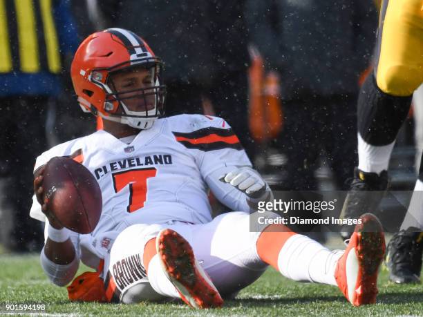 Quarterback DeShone Kizer of the Cleveland Browns lays on the field after being sacked in the first quarter of a game on December 31, 2017 against...