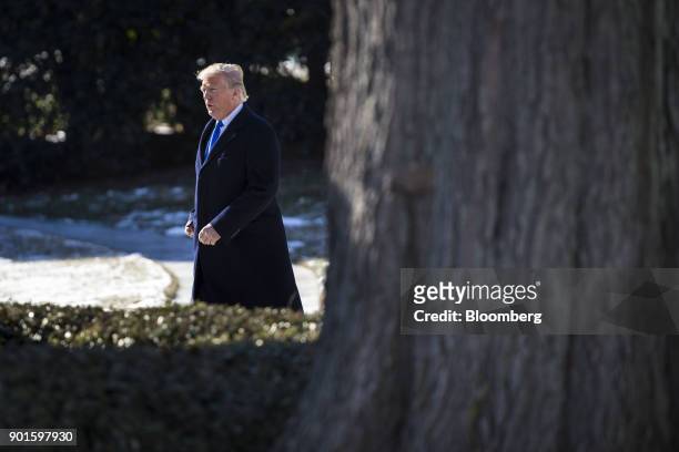 President Donald Trump walks towards Marine One on the South Lawn of the White House in Washington, D.C., U.S., on Friday, Jan. 5, 2018. Trump is...