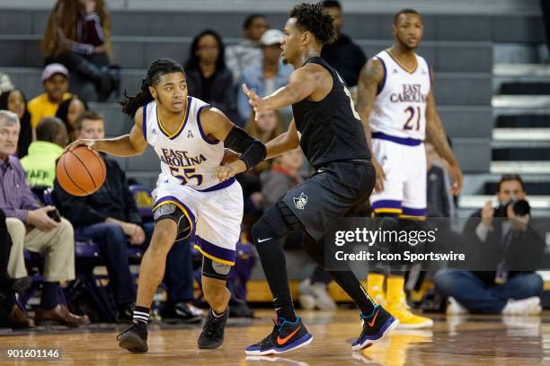 Knights guard Terrell Allen guards East Carolina Pirates guard Shawn Williams during a game between the East Carolina Pirates and the University of...