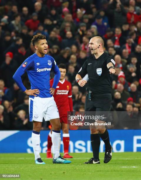 Referee Robert Madley points to the spot as he awards a penalty against Mason Holgate of Everton during the Emirates FA Cup Third Round match between...