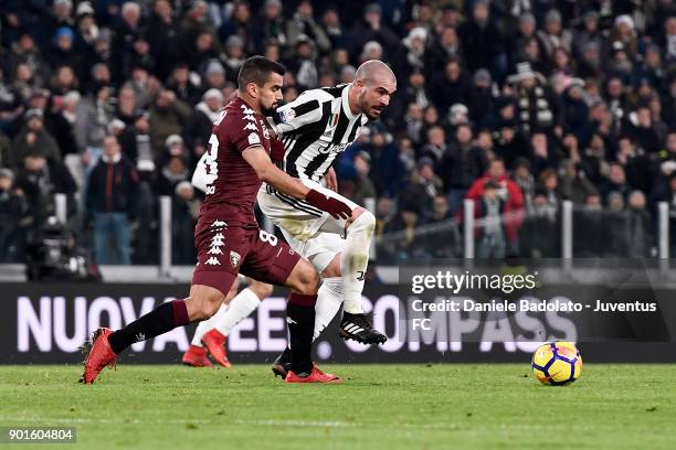 Tomas Rincon and Stefano Sturaro during the TIM Cup match between Juventus and Torino FC at Allianz Stadium on January 3, 20