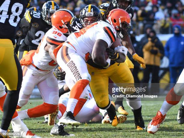 Defensive tackle Tyson Alualu of the Pittsburgh Steelers tackled running back Isaiah Crowell of the Cleveland Browns in the first quarter of a game...