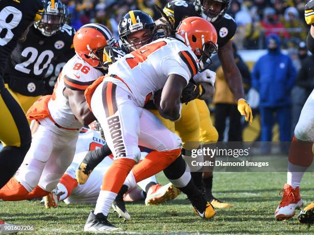 Defensive tackle Tyson Alualu of the Pittsburgh Steelers tackled running back Isaiah Crowell of the Cleveland Browns in the first quarter of a game...