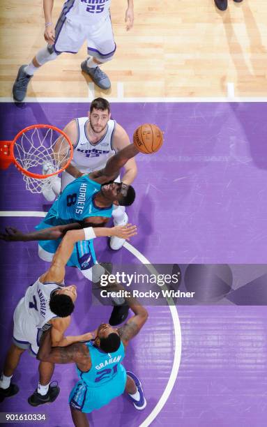 Johnny O'Bryant III of the Charlotte Hornets rebounds against the Sacramento Kings on January 2, 2018 at Golden 1 Center in Sacramento, California....