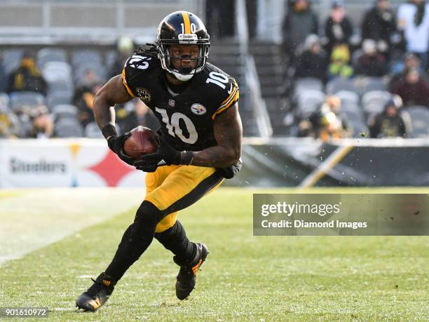 Wide receiver Martavis Bryant of the Pittsburgh Steelers carries the ball downfield in the second quarter of a game on December 31, 2017 against the...