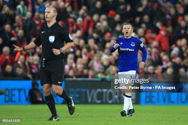 Everton's Wayne Rooney shouts at referee Bobby Madley during the FA Cup, third round match at Anfield, Liverpool.