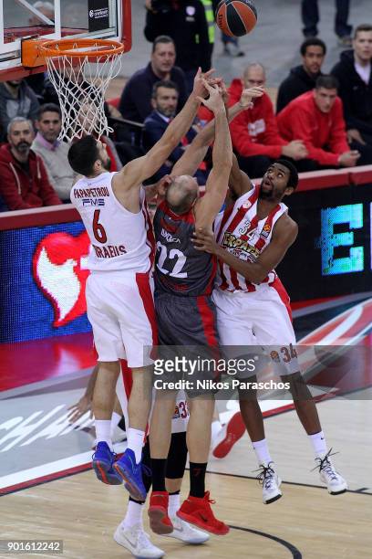 Ioannis Papapetrou, #6 and Hollis Thompson, #34 of Olympiacos Piraeus competes with Marco Cusin, #22 of AX Armani Exchange Olimpia Milan during the...