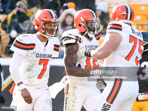 Wide receiver Josh Gordon of the Cleveland Browns celebrates a reception with quarterback DeShone Kizer and left guard Joel Bitonio in the second...