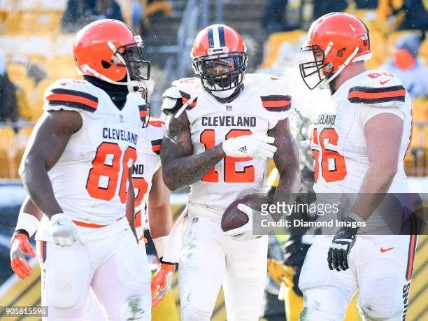 Wide receiver Josh Gordon of the Cleveland Browns celebrates a reception with tight end Randall Telfer and left tackle Spencer Drango in the second...