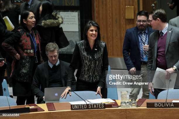 Ambassador to the United Nations Nikki Haley takes her seat at the start of a U.N. Security Council meeting concerning the situation in Iran, January...