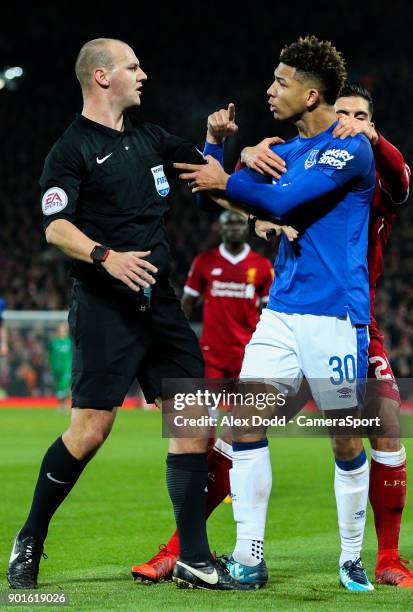 Everton's Mason Holgate appears to manhandle referee Robert Madley over an altercation with Liverpool's Roberto Firmino during the Emirates FA Cup...