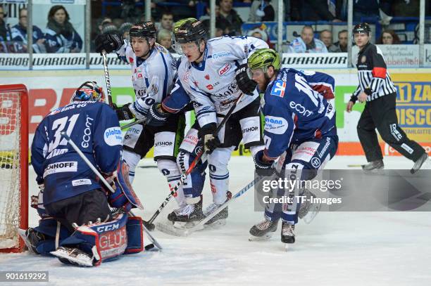 Goalkeeper Sebastian Dahm of Iserlohn, Kyle MacKinnon of Straubing, Alexander Bonsanksen of Iserlohn, Alexander Oblinger of Straubing and Kevin...