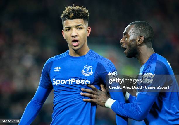 Everton's Mason Holgate is shepherded way by Yannick Bolasie during the Emirates FA Cup Third Round match between Liverpool and Everton at Anfield on...