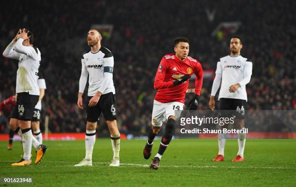 Despair for Derby County players as Jesse Lingard of Manchester United celebrates as he scores their first goal during the Emirates FA Cup Third...