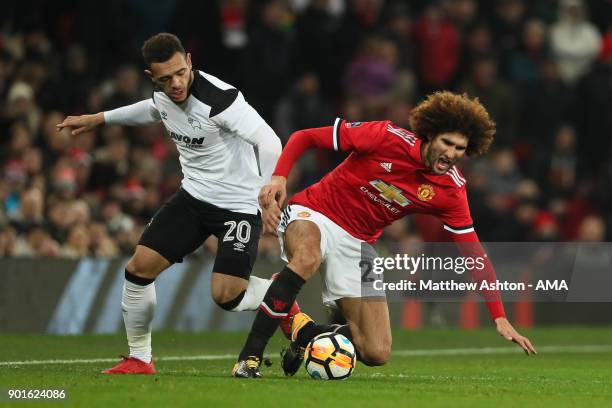 Marouane Fellaini of Manchester United competes with Mason Bennett of Derby County during the Emirates FA Cup Third Round match between Manchester...