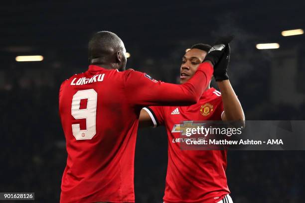 Romelu Lukaku of Manchester United celebrates scoring a goal to make the score 2-0 with Anthony Martial during the Emirates FA Cup Third Round match...