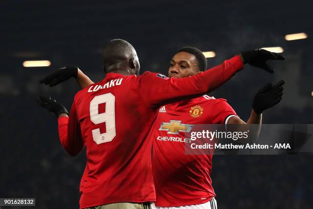 Romelu Lukaku of Manchester United celebrates scoring a goal to make the score 2-0 with Anthony Martial during the Emirates FA Cup Third Round match...