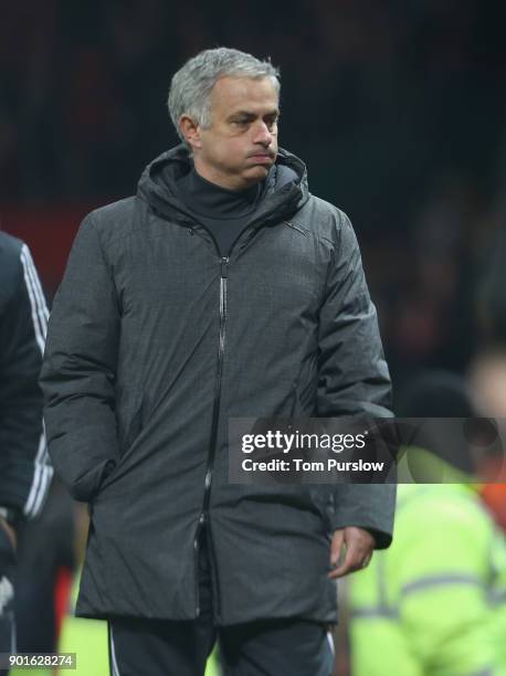 Manager Jose Mourinho of Manchester United walks off after the Emirates FA Cup Third Round match between Manchester United and Derby County at Old...