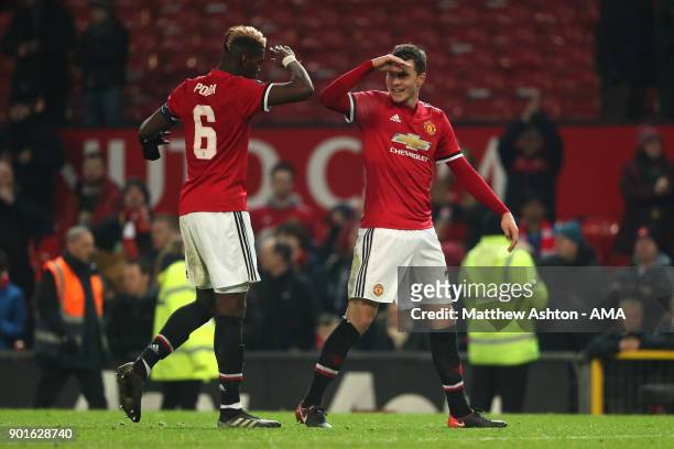 Paul Pogba and Victor Lindelof of Manchester United celebrate at the end of the Emirates FA Cup Third Round match between Manchester United and Derby...