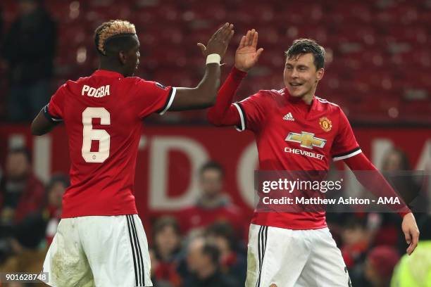 Paul Pogba and Victor Lindelof of Manchester United celebrate at the end of the Emirates FA Cup Third Round match between Manchester United and Derby...