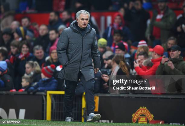 Jose Mourinho, Manager of Manchester United looks on after the Emirates FA Cup Third Round match between Manchester United and Derby County at Old...