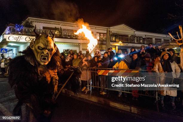 Participant dressed as 89° takes part in the Palio Of The Pignarulars And Krampus as part of Epiphany celebrations on January 5, 2018 in Tarcento,...