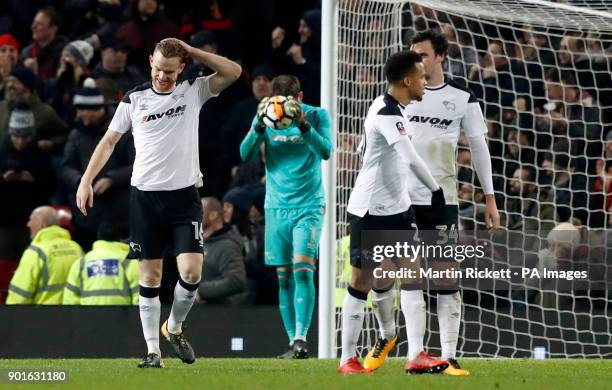 Derby County react after conceding during the FA Cup, third round match at Old Trafford, Manchester.