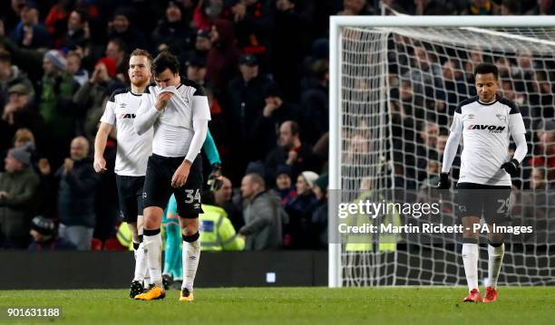 Derby County react after conceding during the FA Cup, third round match at Old Trafford, Manchester.