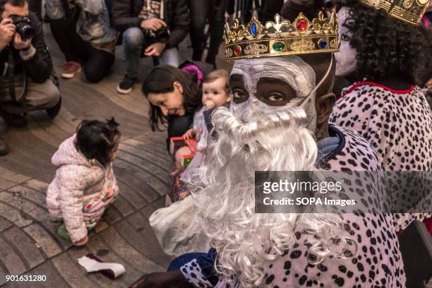 The Kings street vendors seen distributing candies to children. The Three Wise Men handing out candies is a Spanish tradition since the 19th century....