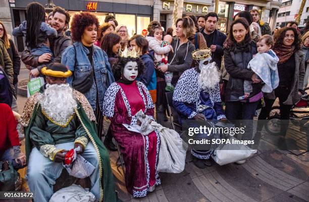 The Kings street vendors seen distributing candies to children. The Three Wise Men handing out candies is a Spanish tradition since the 19th century....