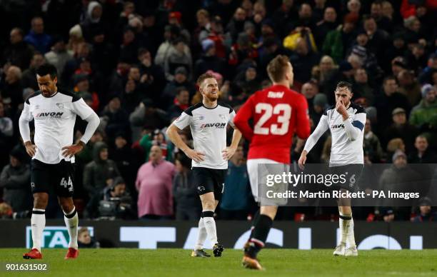 Derby County react after conceding a second goal during the FA Cup, third round match at Old Trafford, Manchester.
